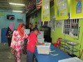A child casts his vote as an election observer monitors the process