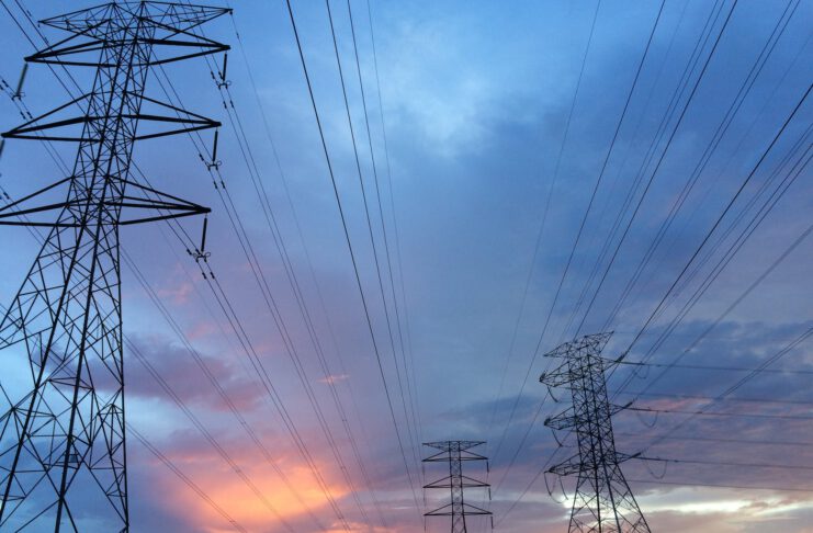 transmission tower under gray sky