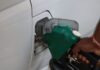 Malaysia has new oil friends – but does it have a plan B? fuel pumping into car at a gas station