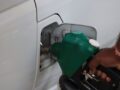 fuel pumping into car at a gas station